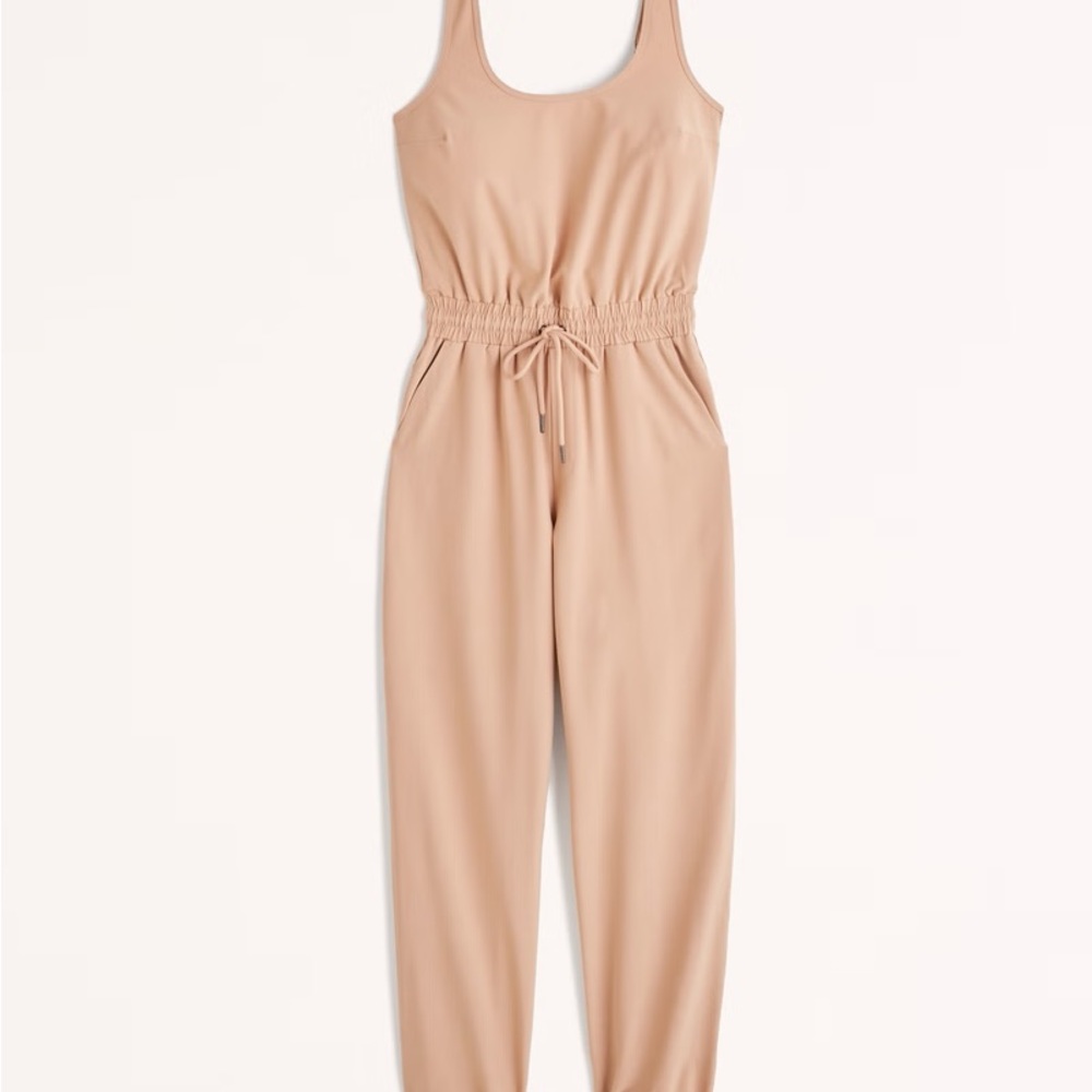 Cream Sleeveless Jumpsuit with Scoop Neckline and Tapered Legs with tags! New!